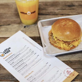 effinegg Photo of breakfast sandwich, orange juice and restaurant menu.